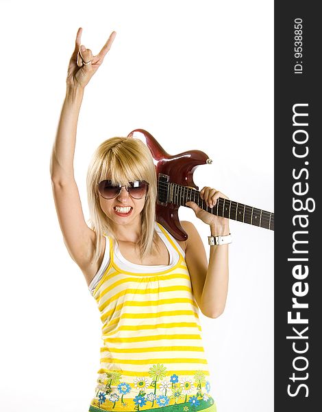 Portrait of an attractive woman guitarist making a rock sign