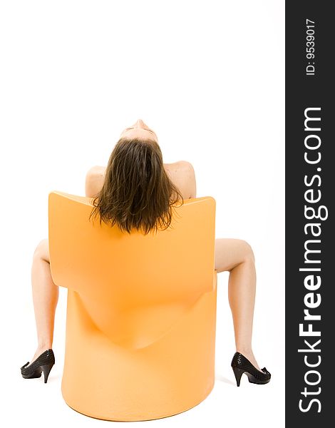 Picture of a woman on a chair, back view