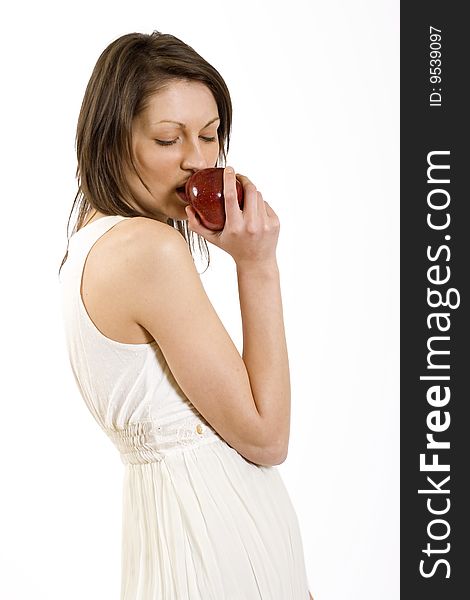 attractive young woman biting a red apple