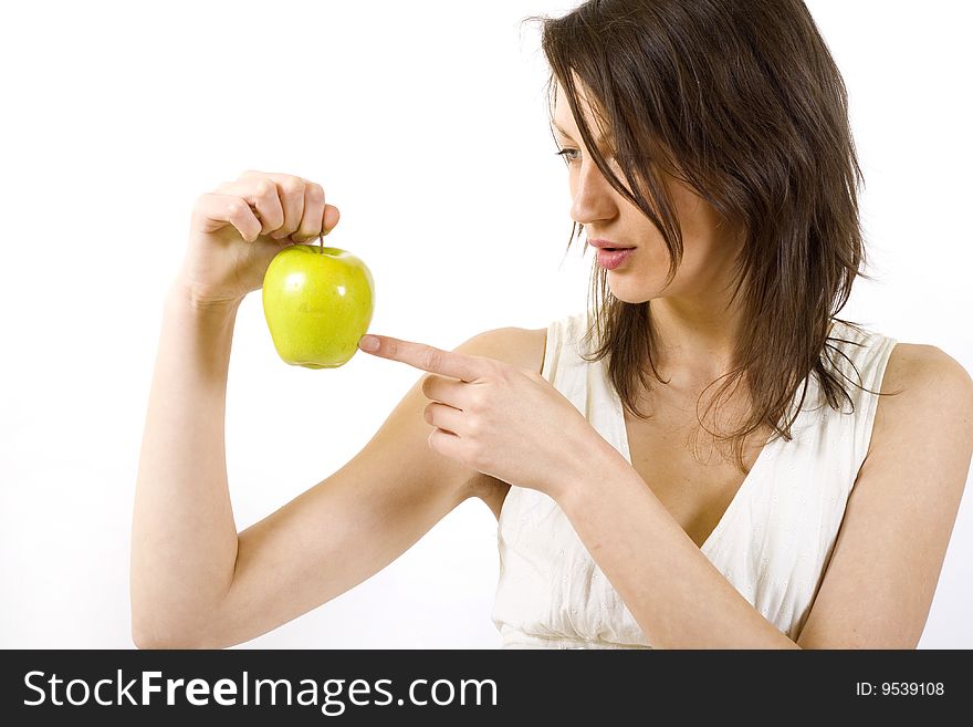Young attractive woman holding yellow apple