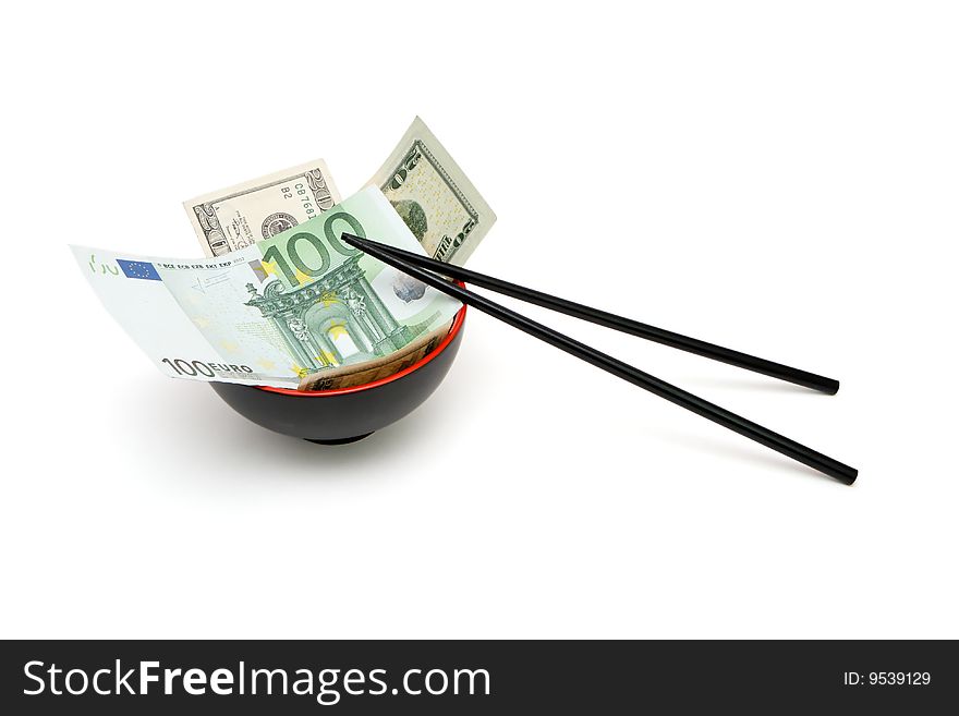 Money in red and black oriental bowl with chopsticks isolated. Money in red and black oriental bowl with chopsticks isolated