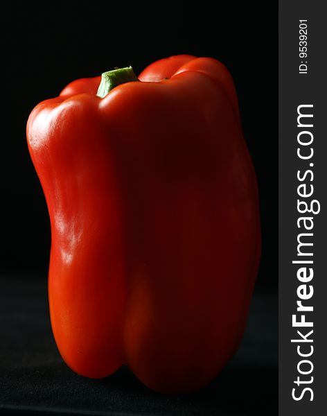 Food Red pepper on black