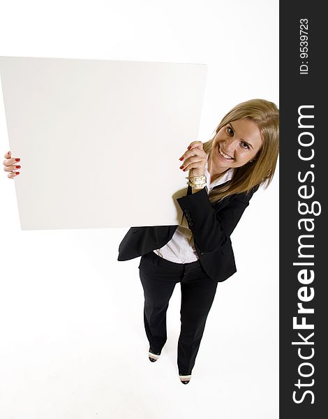 Wide angle picture of an attractive businesswoman presenting a blank board