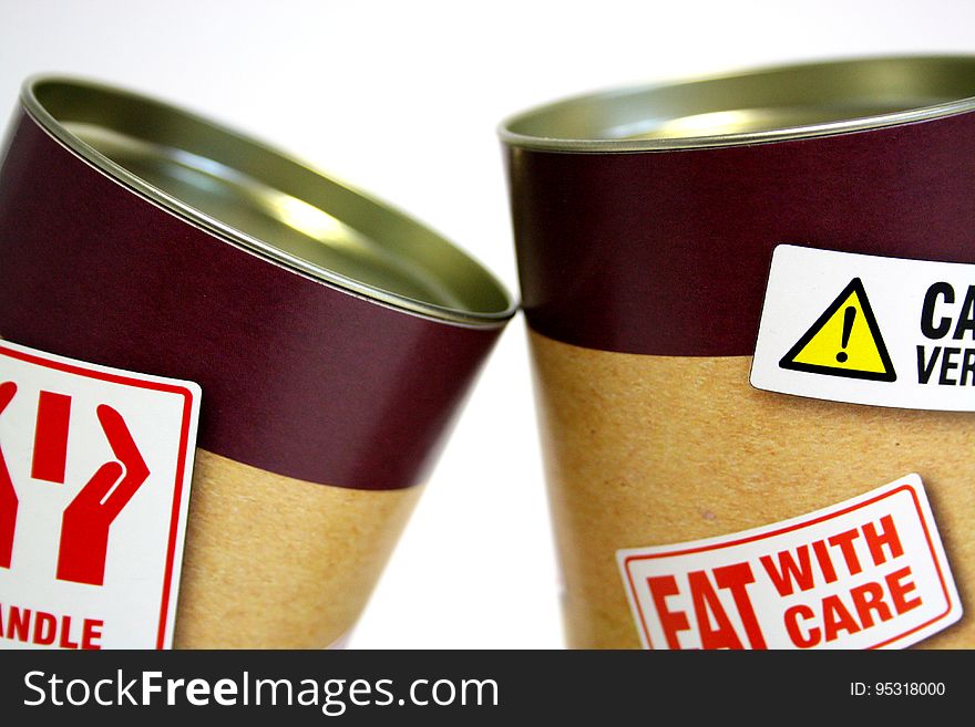 Two Cans With Fat Warning Stickers
