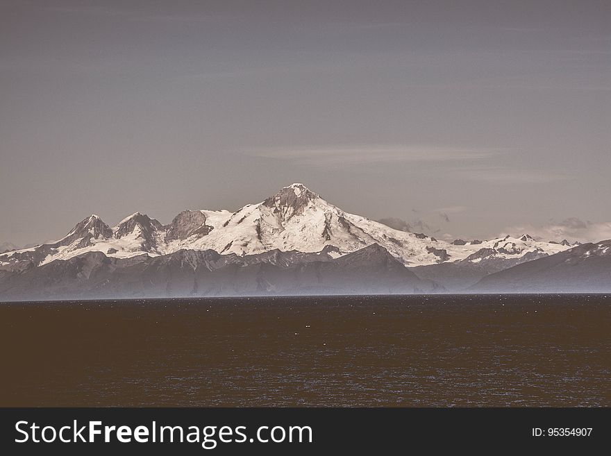 The sea and snowcapped mountain peaks in the background. The sea and snowcapped mountain peaks in the background.