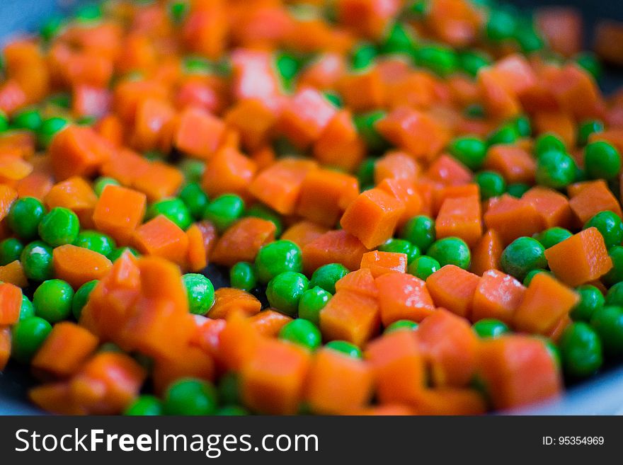Diced carrots with green peas in a pot. Diced carrots with green peas in a pot.