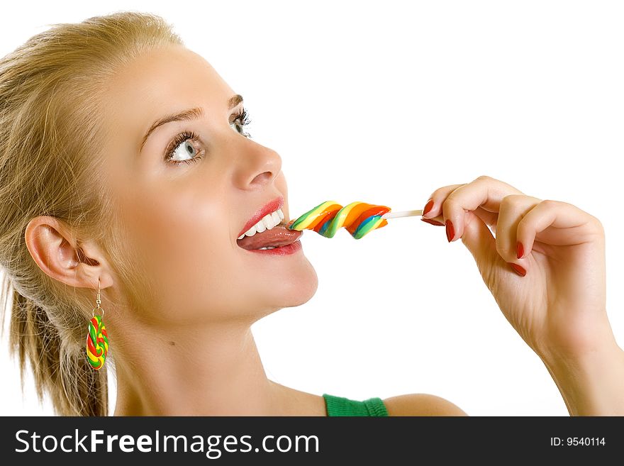Closeup of an attractive woman sucking on a lolly pop