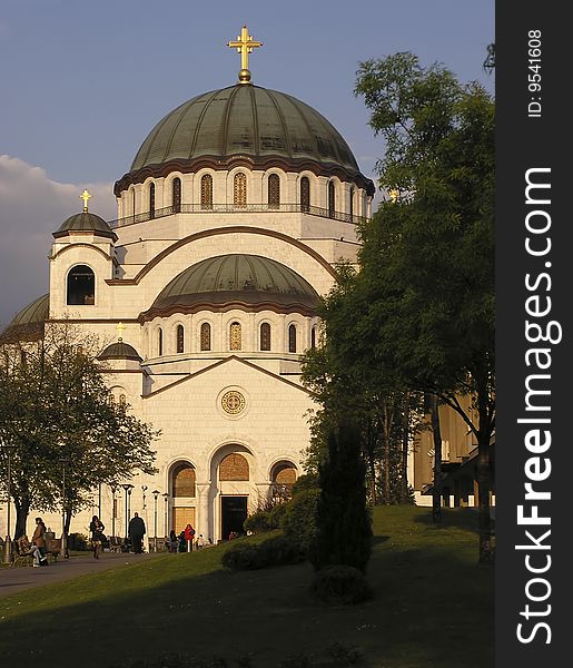 Main entrance to orthodox church in Belgrade Serbia, temple of Sveti Sava, against clear blue sky.