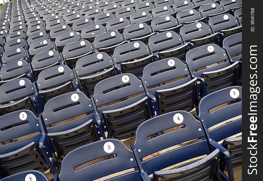 Empty rows of seats in a baseball stadium. Empty rows of seats in a baseball stadium.