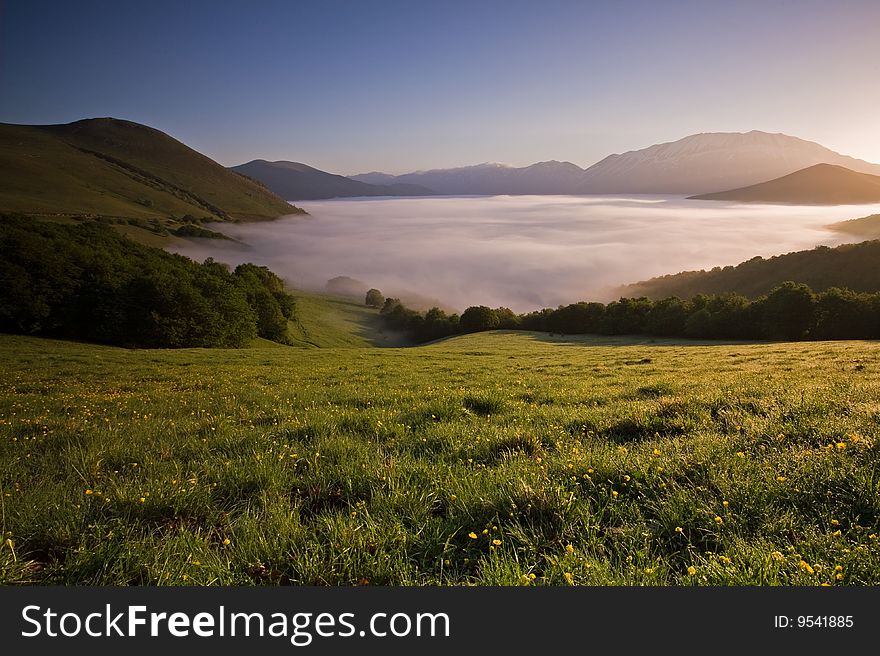 Mist covering the Piano Grande, Umbria, Italy