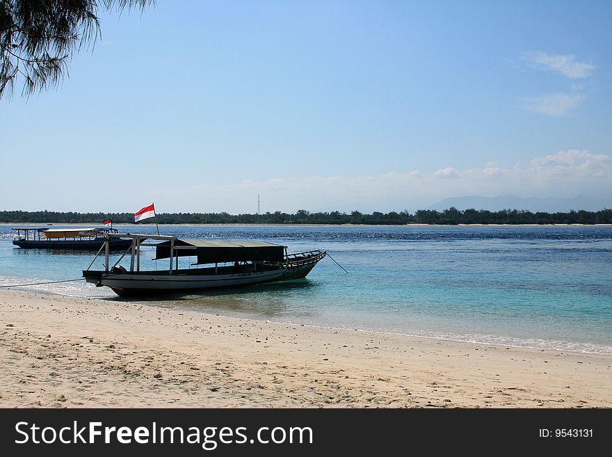 Boat On The Beach Of The Tropical Island