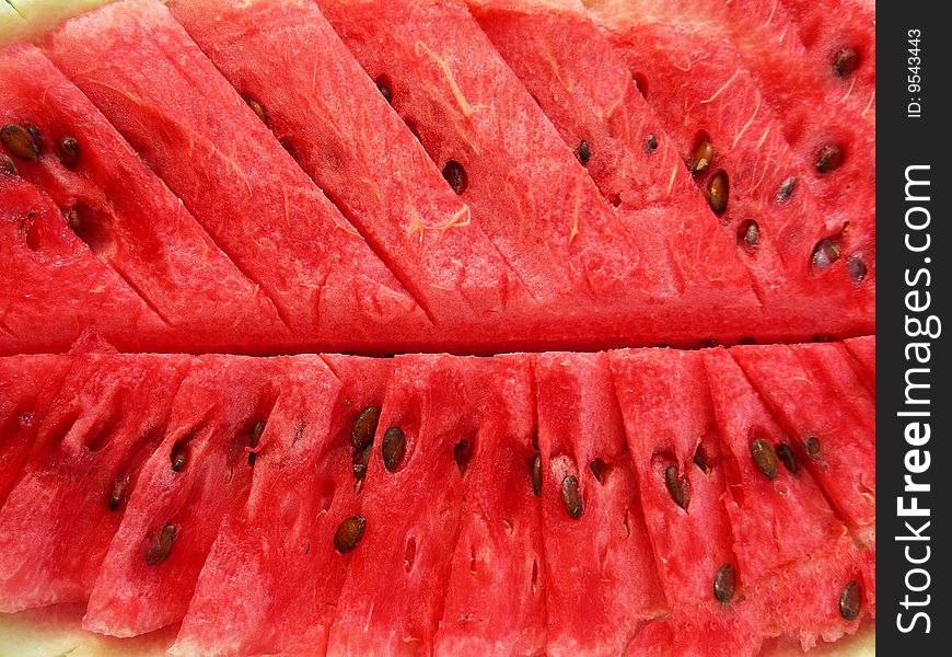 A background of a cut juicy yummy watermelon. A background of a cut juicy yummy watermelon