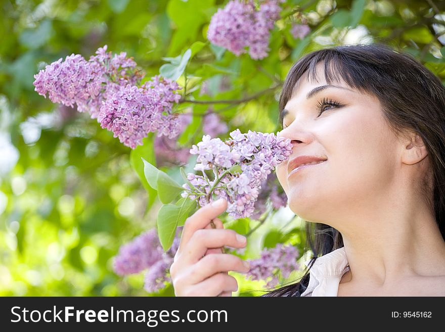 Attractive brunette woman relaxing  on grass in park. Attractive brunette woman relaxing  on grass in park