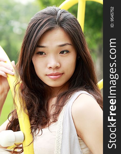 Asian girl's outdoor portrait in summer. Asian girl's outdoor portrait in summer.