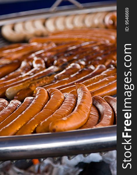 Grilled sausages on the round  barbeque