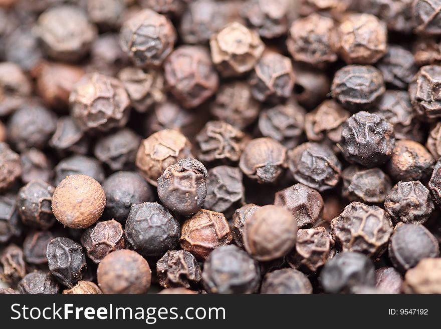 A macro shot of black peppercons. A macro shot of black peppercons.