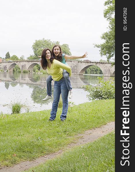 Mother and daughter playing in the park