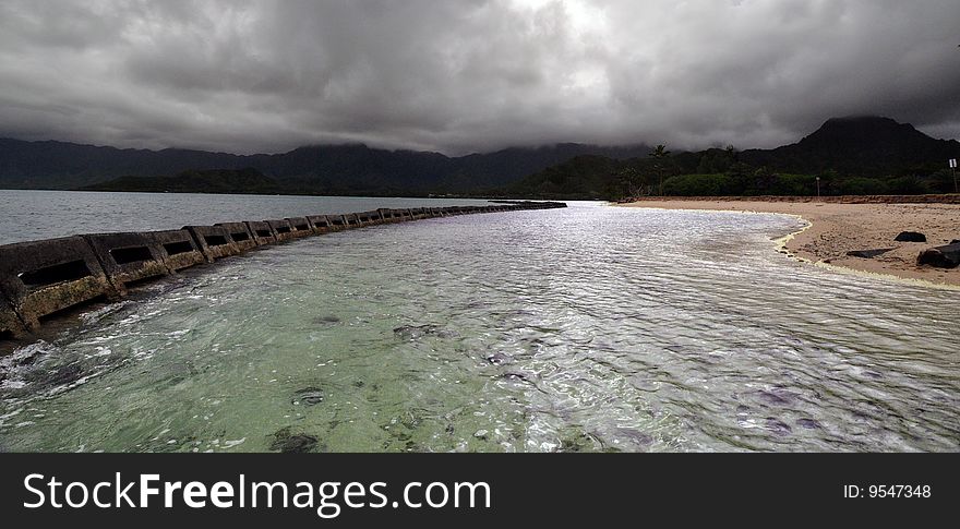 This is a view of the West Side of Oahu's shoreline and mountains as a storm is rolling in. This is a view of the West Side of Oahu's shoreline and mountains as a storm is rolling in.