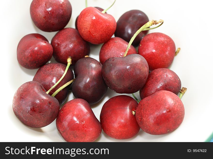 Sweet and sour cherries on white