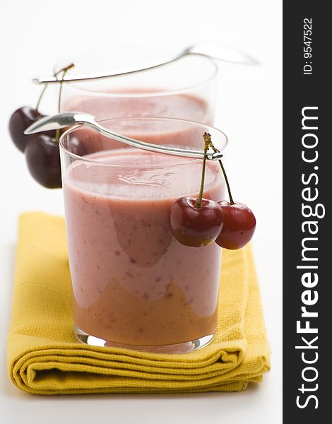 A delicious cherry milkshake isolated over white