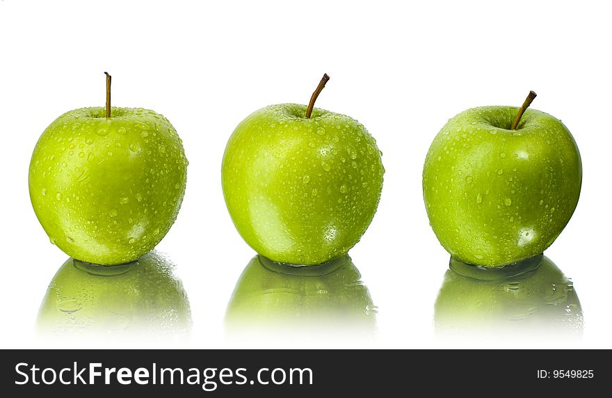 Three green apples with water drops with white background. Three green apples with water drops with white background