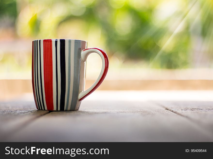 A close up of a striped tea mug. A close up of a striped tea mug.