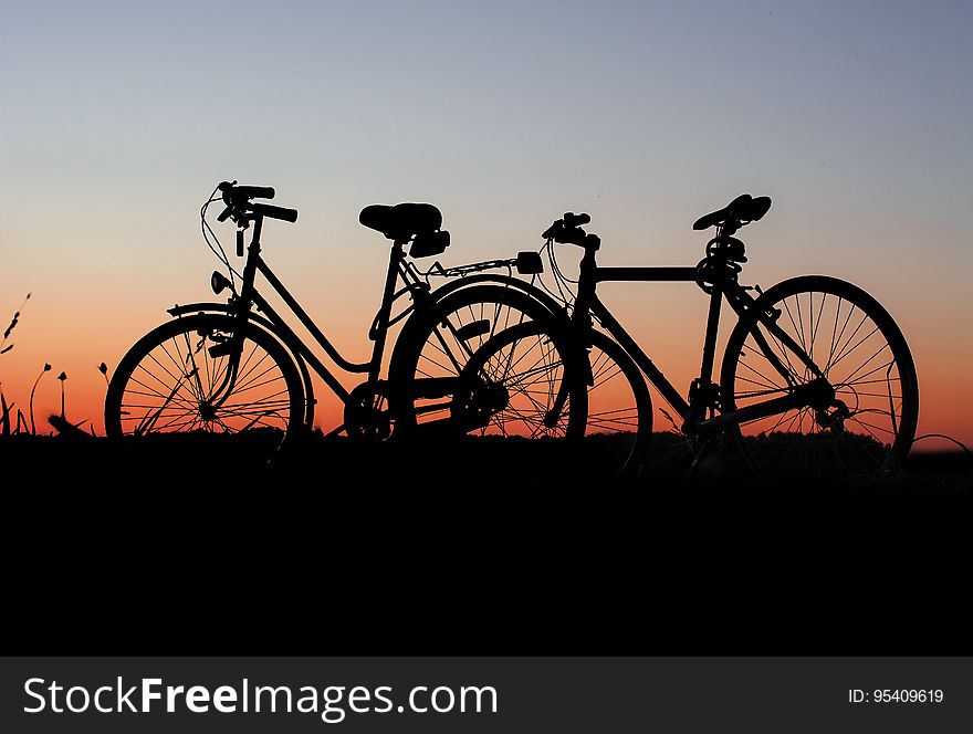 Silhouette of bicycles in countryside at sunset. Silhouette of bicycles in countryside at sunset.