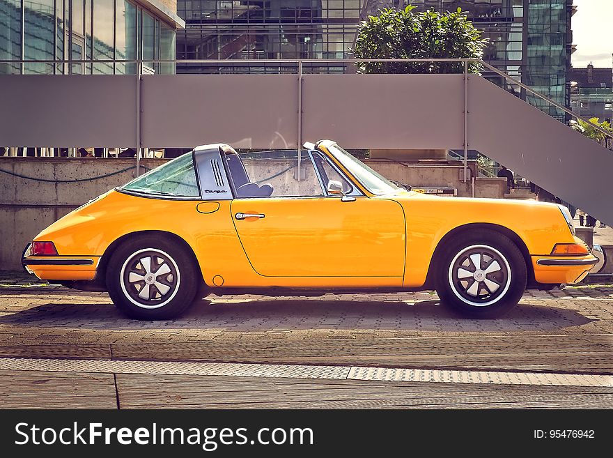 Yellow Porsche 911 motor car
