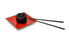 Objective Lens On Oriental Plate With Chopsticks Royalty Free Stock Photos Objective Lens On Oriental Plate With Chopsticks Royalty Free Stock Photos