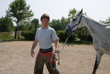Farrier And Gray Horse Royalty Free Stock Photo