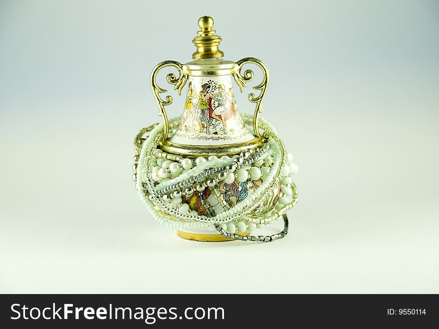Old amphora with perfumes and accessories