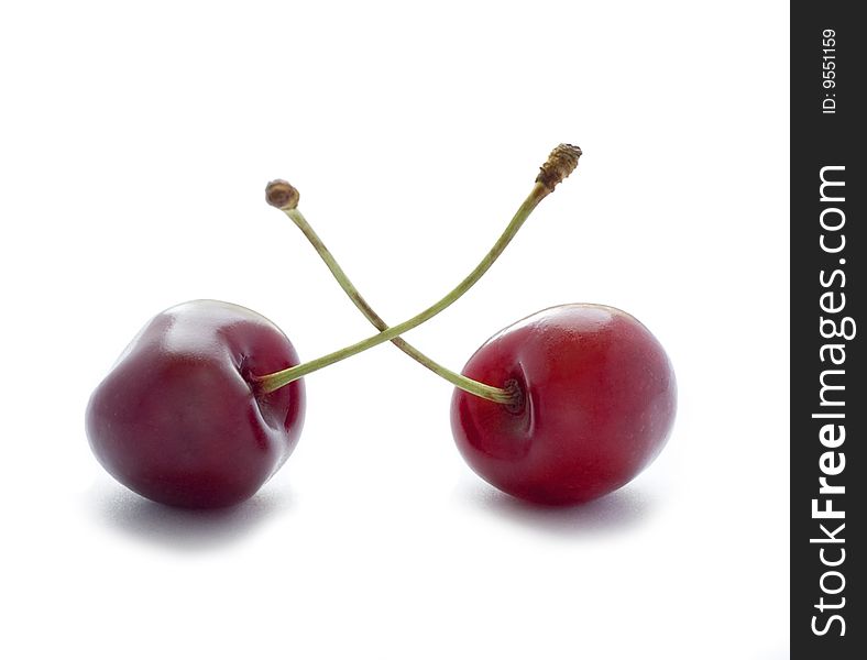 Two cherries isolated on white