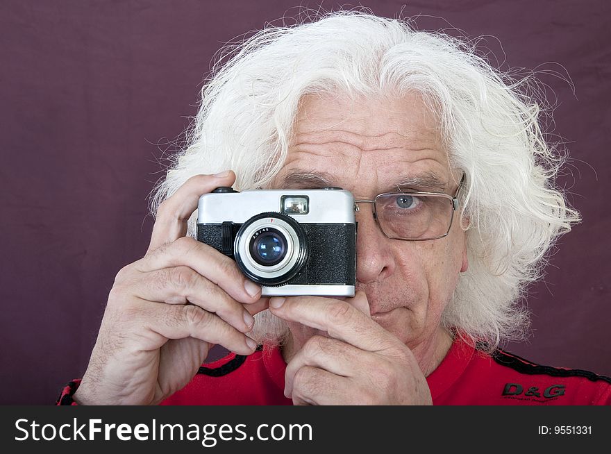 Older man taking a photo