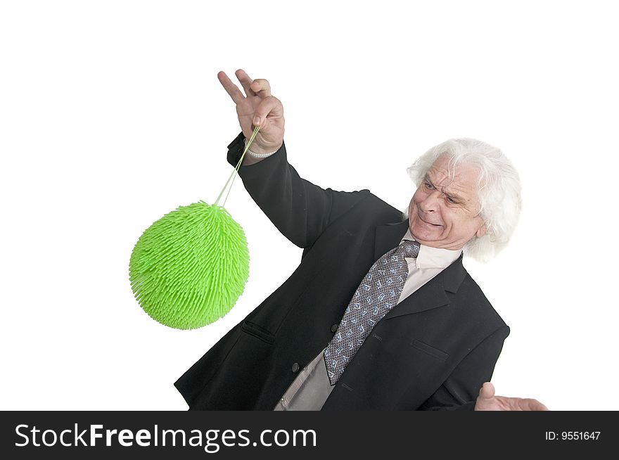 Older man playing with green ball