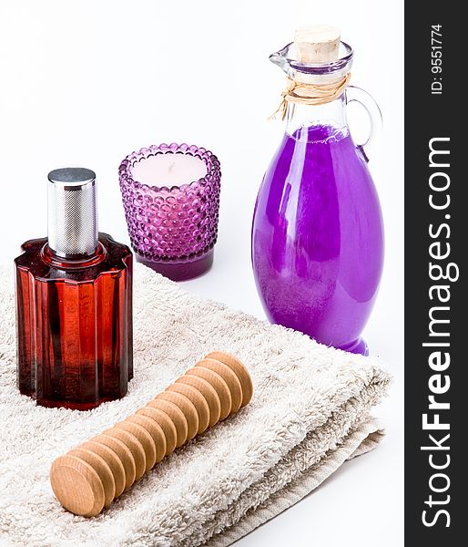 Massage oil with decorations on a towel. Massage oil with decorations on a towel.