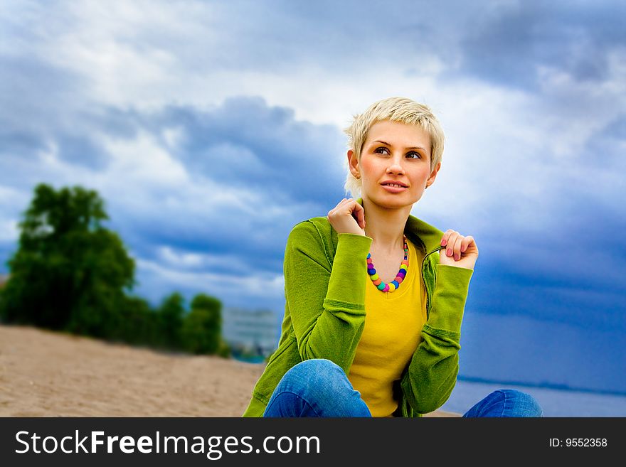 Portrait of the girl against the cloudy sky. Portrait of the girl against the cloudy sky