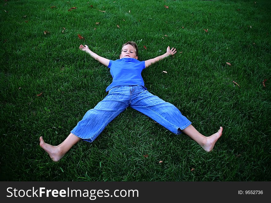 Boy on a green grass