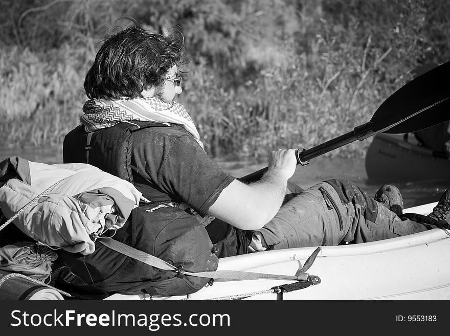 Tourist sailing on kayak (b&w)