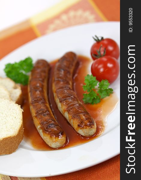 Grilled sausage with tomato ketchup.