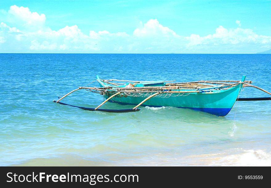 A boat on a tropical beach