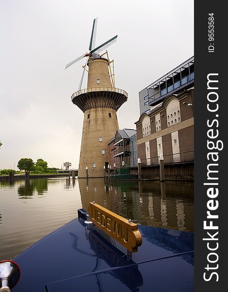 A beautiful Dutch windmill seen from a boat