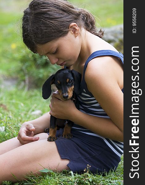 Girl in the grass with pet dog. Girl in the grass with pet dog