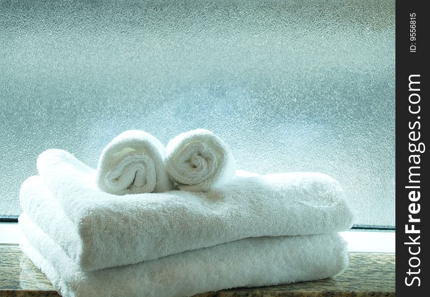 Face-like towels in front of a translucent window. Face-like towels in front of a translucent window