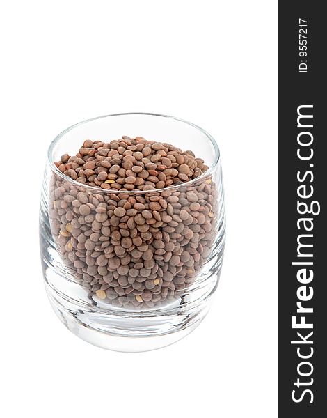 Green lentils in glass, white background