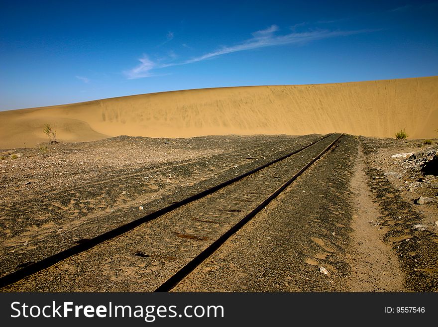 Sand dune that has engulfed a railway line in Namibia. Sand dune that has engulfed a railway line in Namibia