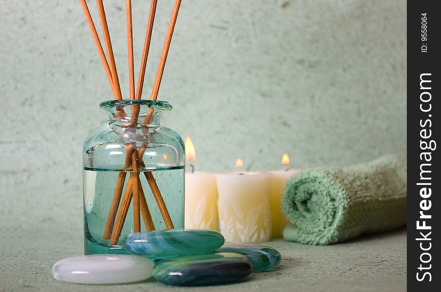 Zen stones with spa with candles on a bluw background. Zen stones with spa with candles on a bluw background.