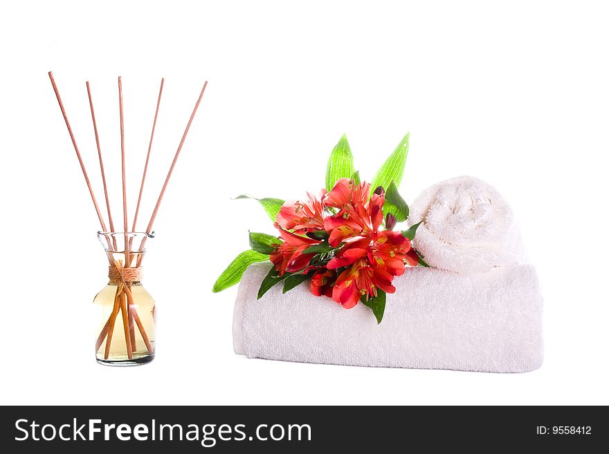 Scented and spa oil with flowers and towels. Scented and spa oil with flowers and towels.