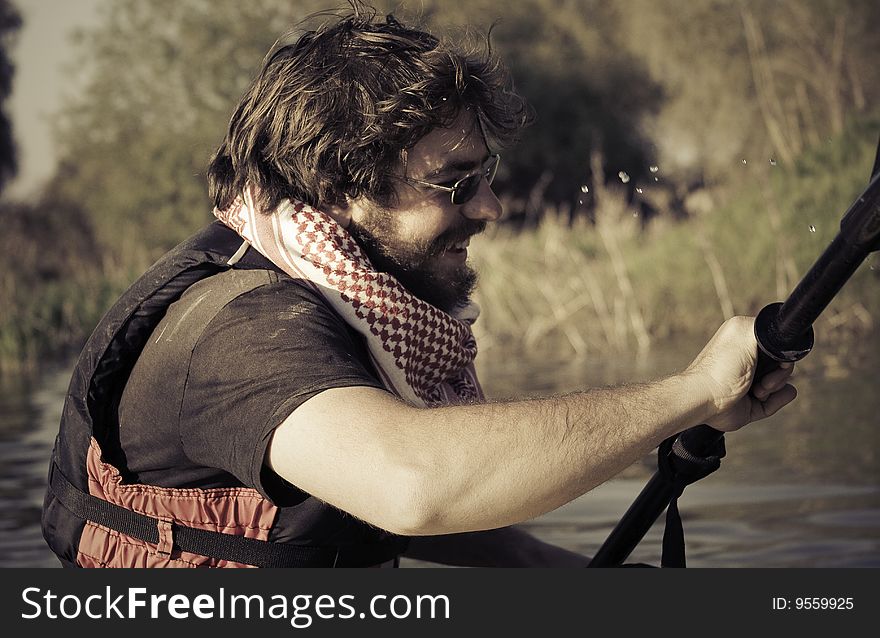 Tourist Sailing On Kayak