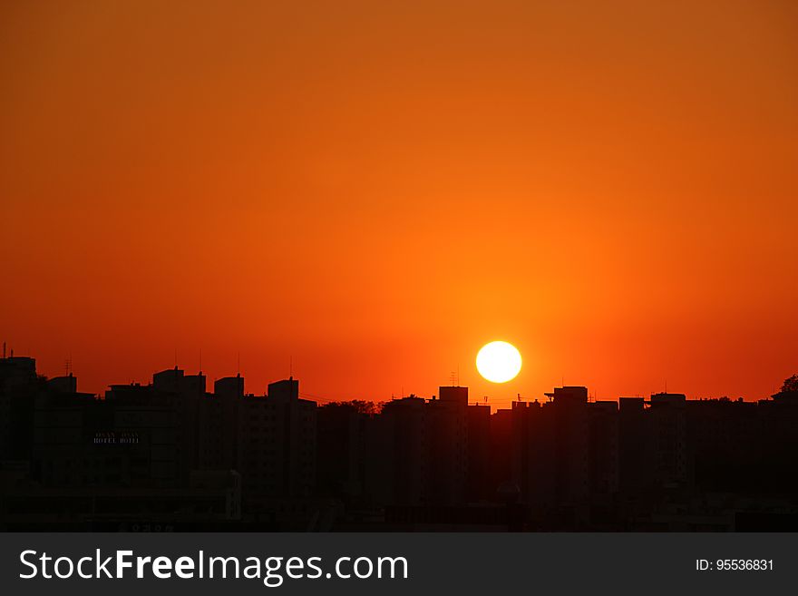 Silhouette Cityscape Against Romantic Sky at Sunset