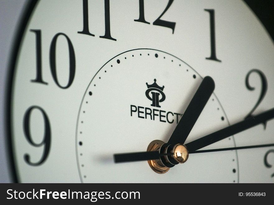Close up of Perfect clock face with black hands. Close up of Perfect clock face with black hands.